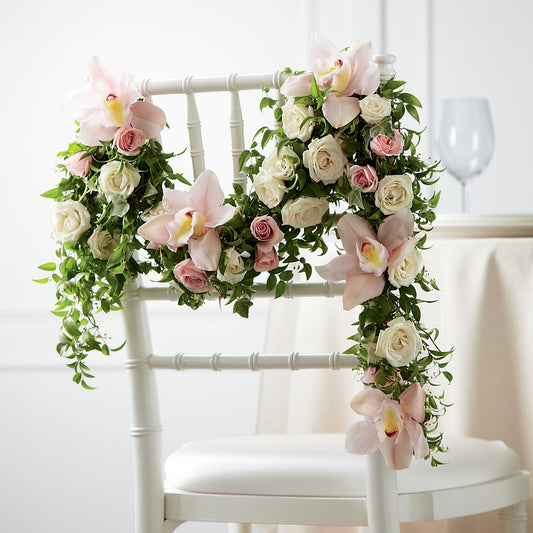 Decoración de silla con rosa orquídea